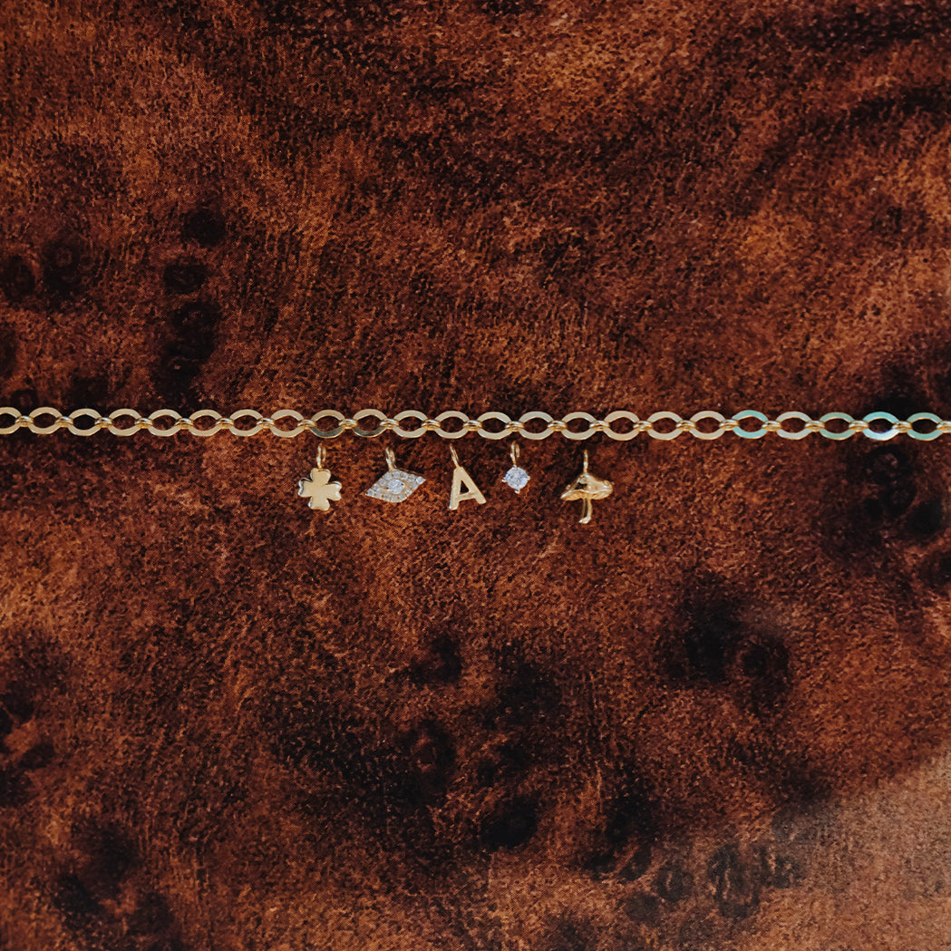 Infinity bracelet to compose – 18-karat gold chain & charms