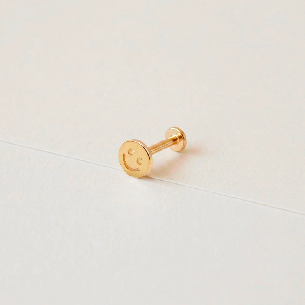 Smiley Ohrpiercing aus Gold